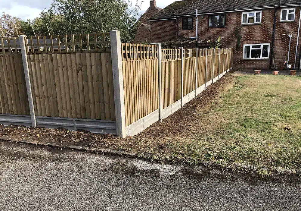 New wooden garden fence beside a house